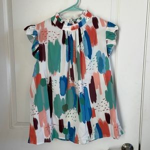 Colorful blouse with ruffle sleeves and keyhole back